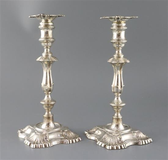 A pair of late Victorian silver candlesticks by William Hutton & Sons Ltd, weighted.